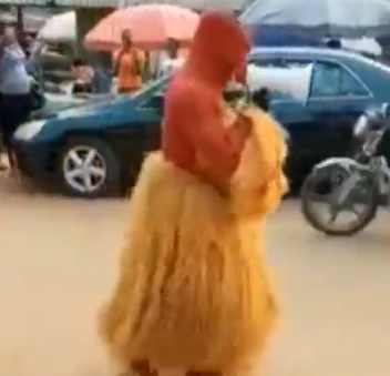 Man in masquerade attire spotted on the streets in Nigeria preaching the gospel of Jesus Christ (video)