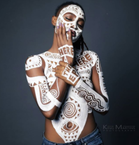 Ex BBN housemate, Marvis poses completely topless with body paint in new photos