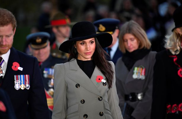 Meghan Markle and Prince Harry look sombre as they sing hymns at dawn service commemorating Anzac Day in London