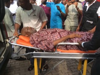 Photos of Dino Melaye being brought into the court on a stretcher, re-arrested by the police after granted bail