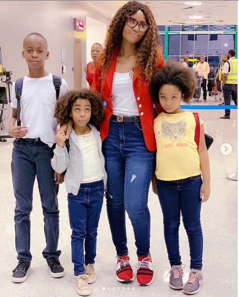 Regina Daniels jets out with her stepchildren for vacation (Photos)