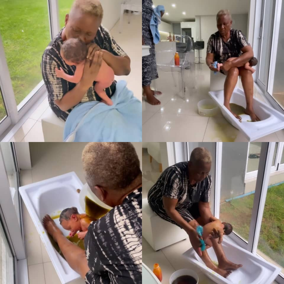 Reality TV star, Omashola, shares heartwarming video of his mum bathing and massaging his son, Eyitemi