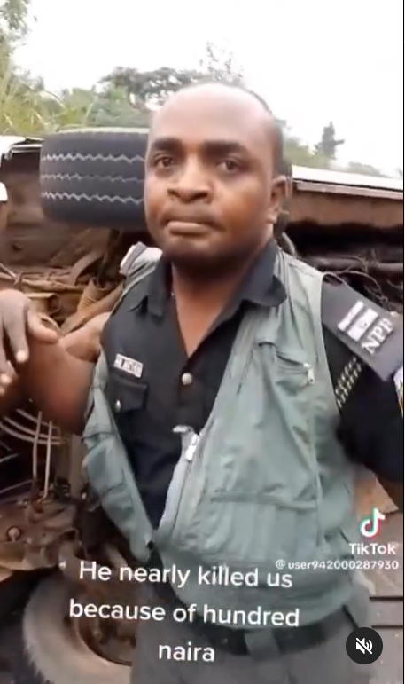 Policeman accosted by angry commuters for 'almost causing their death over N100' (video)